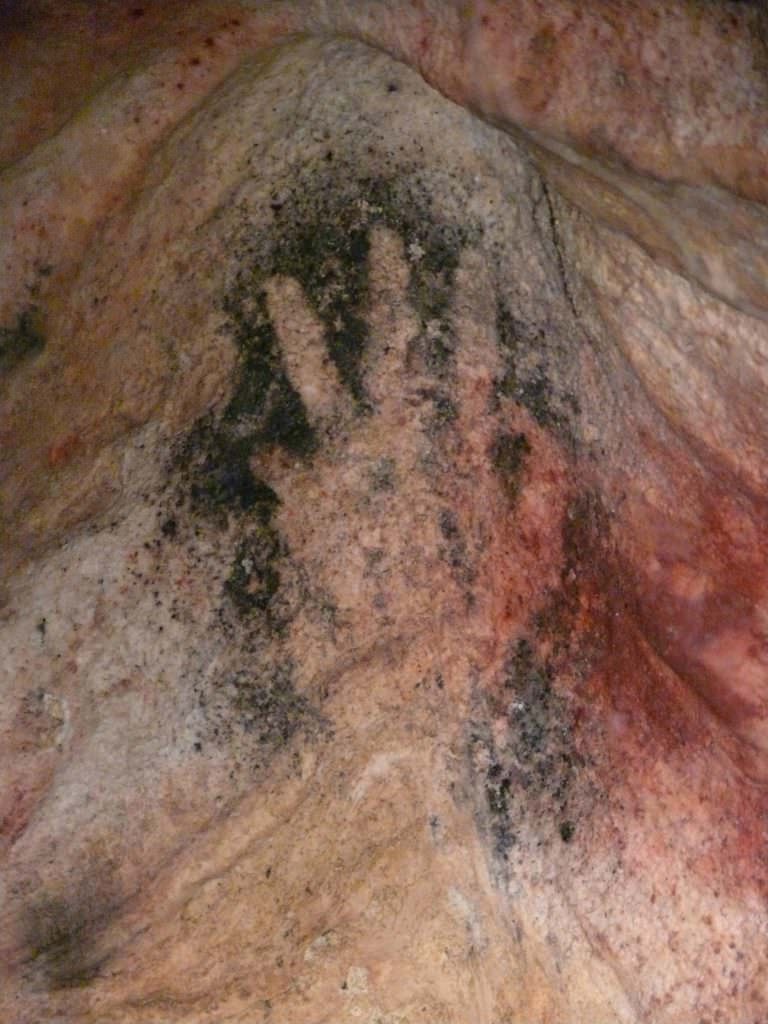visit the gargas caves
 hand on gargas walls